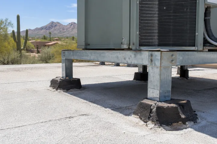 Worn foam around the base of a rooftop air conditioner stand